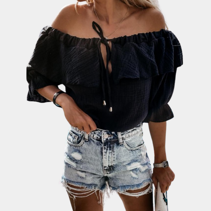 Afslappet off-shoulder bluse med flæser